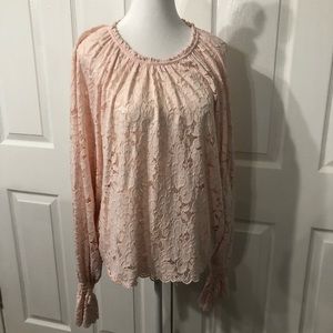 Women’s Free People Large polyester peach lace top.  Elastic at wrists flare out